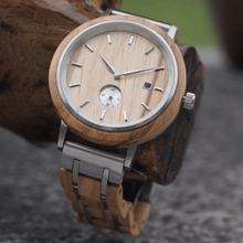 Load image into Gallery viewer, Olive wood and stainless steel watch hanging on tree branch
