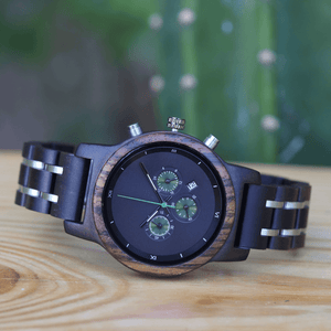 ebony, zebrawood, and stainless steel watch on wood 