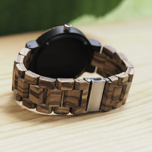 Closed metal back closure of zebrawood, ebony, and maple watch