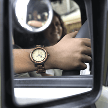 Load image into Gallery viewer, Reflection of man wearing a wooden watch while driving 
