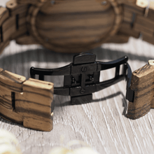 Load image into Gallery viewer, Black metal hidden closure on zebrawood watch
