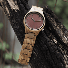 Load image into Gallery viewer, Zebrawood wooden watch hanging on a branch

