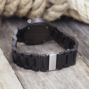 Metal back closure on ebony wooden watch