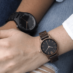 Two people wearing dark wooden watches