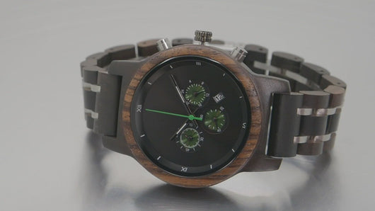 ebony, zebrawood, and stainless steel wooden watch spinning on turntable
