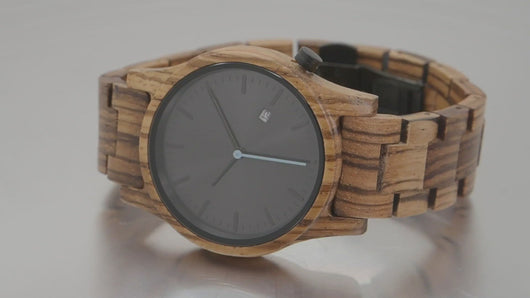 Zebrawood watch spinning on turntable